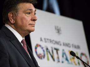 Ontario Finance Minister Charles Sousa speaks to reporters in Queens Park in Toronto on Tuesday, November 14, 2017. THE CANADIAN PRESS/Christopher Katsarov
