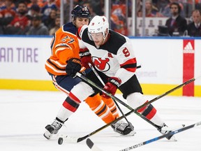 Taylor Hall battles against Edmonton's Milan Lucic at Rogers Place in Edmonton on Friday, Nov. 3, 2017.