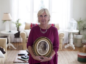 Alison Steel holds a photo of her mom, Jean Steel, in her home in Knowlton, Quebec November 10, 2017.