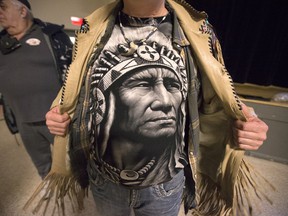 Robin Robichaud shows his t-shirt after a meeting for the Wobtegwa aboriginal community, a new Metis group.
