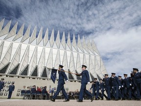 FILE - In this May 15, 2017 file photo, Air Force Academy Cadets pass in review after Brig. Gen. Kristin Goodwin assumed command of the AFA cadet wing at a ceremony at the Air Force Academy in Colorado Springs, Colo. An internal Air Force Academy investigation found that the school's Sexual Assault Prevention and Response was crippled by infighting, poor management, rumors and shoddy record-keeping and was derelict in performing its duties. The report, obtained by the Colorado Springs Gazette, said the director should be fired, but she resigned, the newspaper reported. (Mark Reis /The Gazette via AP, File)