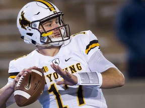 Wyoming quarterback Josh Allen (17) warms up as they face off against Air Force in an NCAA college football game in Colorado Springs, Colo., Saturday Nov. 11, 2017. (Dougal Brownlie/The Gazette via AP)