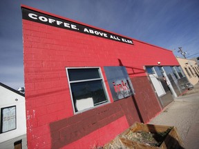 The Ink! coffee shop is shown after graffiti was erased from the walls of the building in the River North Art district Monday, Nov. 27, 2017, in Denver. The shop, which is part of a Colorado chain, has been in the eye of a storm of outrage from neighbors after putting up a sidewalk sign that said the owners were "happily gentrifying" the area, a transformation that has forced many of the former residents and businesses to move out and make way for salons, pilates studios and brew pubs. (AP Photo/David Zalubowski)