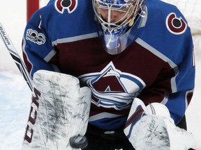 Colorado Avalanche goalie Semyon Varlamov, of Russia, makes a save of a shot against the Winnipeg Jets in the first period of an NHL hockey game Wednesday, Nov. 29, 2017, in Denver. (AP Photo/David Zalubowski)