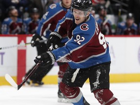 Colorado Avalanche left wing Gabriel Landeskog, of Sweden, follows through with his shot against the Washington Capitals in the first period of an NHL hockey game Thursday, Nov. 16, 2017, in Denver. (AP Photo/David Zalubowski)