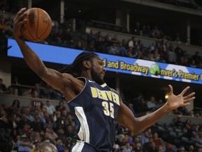 Denver Nuggets forward Kenneth Faried grabs a rebound against the Orlando Magic during the second quarter of an NBA basketball game Saturday, Nov. 11, 2017, in Denver. (Photo by Jack Dempsey)