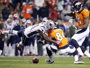 Denver Broncos wide receiver Isaiah McKenzie (84) fumbles the punt as New England Patriots cornerback Jonathan Jones (31) makes the tackle during the first half of an NFL football game, Sunday, Nov. 12, 2017, in Denver. The Patriots recovered the football. (AP Photo/Jack Dempsey)