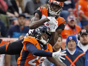 Denver Broncos free safety Bradley Roby (29) breaks up a pass intended for Cincinnati Bengals wide receiver Cody Core during the first half of an NFL football game, Sunday, Nov. 19, 2017, in Denver. (AP Photo/Jack Dempsey)