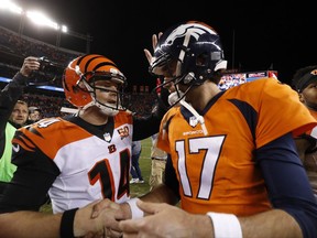 Denver Broncos quarterback Brock Osweiler (17) and Cincinnati Bengals quarterback Andy Dalton (14) meet after an NFL football game, Sunday, Nov. 19, 2017, in Denver. The Bengals won 20-17. (AP Photo/Jack Dempsey)