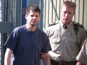 Accused child abductor Randall Hopley is led out of the Cranbrook, B.C., courthouse on Wednesday, Sept. 14, 2011. THE CANADIAN PRESS/Bill Graveland