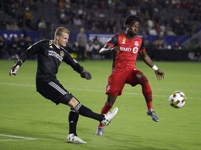 Los Angeles Galaxy goalkeeper Jon Kempin, left, kicks the ball away from Toronto FC's Tosaint Ricketts during the first half of an MLS soccer match in Carson, Calif., on September 16, 2017. Tosaint Ricketts will be in the spotlight Tuesday when, in the absence of suspended stars Jozy Altidore and Sebastian Giovinco, he leads the Toronto FC attack against Columbus in Game 1 of the MLS Eastern Conference final. Ricketts, a Canadian international who has proved to be a capable deputy when called upon at TFC, is no stranger to pressure after a soccer career that has taken him around the globe. THE CANADIAN PRESS/AP, Jae C. Hong