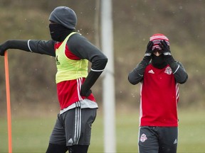 Toronto FC's Jozy Altidore, left, and d Sebastian Giovinco keep warm during practice ahead of the MLS championship final match against the Seattle Sounders in Toronto on Thursday, December 8, 2016. Toronto FC's mission in Columbus this week is simple. Come home with something from the first leg of the Eastern Conference final. They will have to do it Tuesday in Game 1 of home-and-away series without suspended strikers Altidore and Giovinco.THE CANADIAN PRESS/Nathan Denette