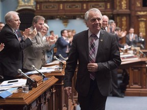 Parti Quebecois MNA Francois Gendron, walks back to his seat as members of the National Assembly applaud for being an elected member for the last 40 years in Quebec City on Tuesday, November 15, 2016. The longest-serving member of Quebec's legislature is apologizing for using the N-word in front of secondary-school students. THE CANADIAN PRESS/Jacques Boissinot