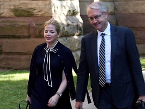 Laura Miller, former deputy chief of staff to former Ontario premier Dalton McGuinty, arrives at court with her lawyer Scott Hutchison in Toronto on Friday, Sept. 22, 2017. The prosecution at Ontario's gas plants trial has asked the courts to acquit the two accused on one of three charges they face.THE CANADIAN PRESS/Colin Perkel