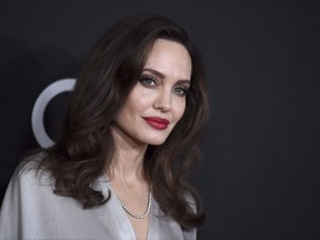 Angelina Jolie arrives at the Hollywood Film Awards at the Beverly Hilton hotel, in Beverly Hills, Calif., on Sunday, Nov. 5, 2017. The Academy Award-winning actress is expected to lend her star power to next week's peacekeeping summit in Vancouver by delivering one of two keynote addresses. THE CANADIAN PRESS/AP-Invision, Jordan Strauss