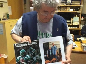 Sister Rosetta Reiniger shows off her picture with former Saskatchewan Roughrider John Chick in January 2016. Sorry Argonauts fans, but God may be sporting a Roughriders jersey and a watermelon helmet when Toronto meets Saskatchewan in this weekend's C-F-L Eastern Conference final. THE CANADIAN PRESS/HO-65 CKOM