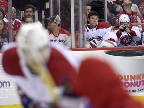 Montreal Canadiens goalie Carey Price, second from right, sits on the bench during the second period of a NHL hockey game against the Washington Capitals, Saturday, Oct. 7, 2017, in Washington. Price said he is staying off the ice for a little while longer as he deals with a lower-body injury. THE CANADIAN PRESS/AP/Nick Wass