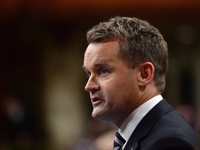Seamus O'Regan, Minister of Veterans Affairs and Associate Minister of National Defence, stands during question period in the House of Commons on Parliament Hill in Ottawa on Monday, Oct. 16, 2017. THE CANADIAN PRESS/Sean Kilpatrick