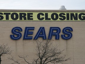 A store closing sign is shown on a Sears store at the Oakville Place mall in Oakville, Ont., west of Toronto, Thursday, Nov.23, 2017. The Competition Bureau is investigating allegations that prices on some merchandise was marked up ahead of the liquidation sales at Sears Canada that began last month, the court-appointed monitor overseeing the retailer says. THE CANADIAN PRESS/Richard Buchan