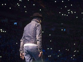 Gord Downie performs at WE Day in Toronto on Wednesday, October 19, 2016. Downie's deeply personal final album "Introduce Yerself" climbed to the top of the Canadian charts in its first week. THE CANADIAN PRESS/Chris Young