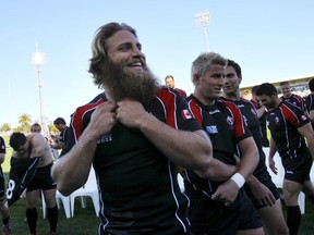 Canada's Adam Kleeberger, centre, prepare for the captain's run following a group photo with teammates in Napier, New Zealand, on September 25, 2011. Kleeberger, who won 38 caps for his country and drew worldwide attention as one of Canada's "beardos," is looking to help others follow his rugby footsteps. THE CANADIAN PRESS/AP-Junji Kurokawa