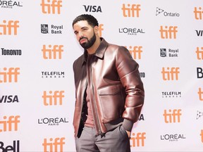 Canadian rapper Drake poses for photographs on the red carpet during the 2017 Toronto International Film Festival in Toronto on Saturday, September 9, 2017. Drake is being praised after issuing a stern warning to a fan to stop touching women at a performance in Australia this week. THE CANADIAN PRESS/Nathan Denette