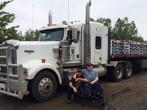Robert Price, left, and his father Dougie Price pose in front of Robert's truck in Tabusintac, N.B. in this undated handout photo. A British Columbia man is facing several charges including kidnapping and use of a firearm after a semi-tractor trailer and its driver were allegedly commandeered by an armed assailant earlier this week. THE CANADIAN PRESS/HO, Robert Price *MANDATORY CREDIT*