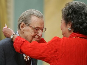 Governor General Adrienne Clarkson presents William Weintraub, of Westmount, Quebec, with the Order of Canada during a ceremony at Rideau Hall in Ottawa Saturday, Oct. 30, 2004. Weintraub, a gifted chronicler of Montreal during the city's heyday and decline, has died at the age of 91. THE CANADIAN PRESS/Jonathan Hayward