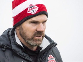 Toronto FC head coach Greg Vanney walks to the field during practice ahead of the MLS championship final match against the Seattle Sounders in Toronto on Wednesday, December 7, 2016. Vanney has been named coach of the year in Major League Soccer. THE CANADIAN PRESS/Nathan Denette