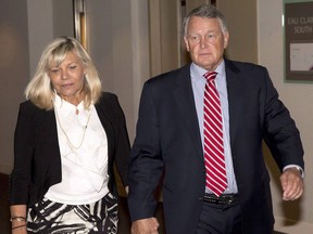 Federal Court Justice Robin Camp, right, and wife Maryann Camp arrive at a Canadian Judical Council inquiry in Calgary on Monday, Sept. 12, 2016. THE CANADIAN PRESS/Larry MacDougal