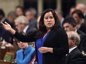 Minister of Justice and Attorney General of Canada Jody Wilson-Raybould responds during Question Period in the House of Commons on Parliament Hill, in Ottawa on Thursday, Oct. 26, 2017. Legal and constitutional experts are calling on the Liberal government to expand the Court Challenges Program to include funding for Indigenous cases under Section 35 of the Constitution in the spirit of reconciliation. THE CANADIAN PRESS/Justin Tang