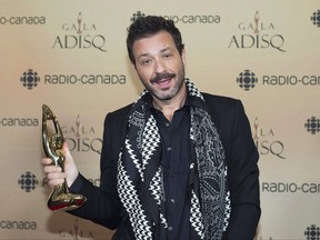 Adam Cohen, son of Leonard Cohen holds up an honour award for his father at the gala Adisq awards ceremony in Montreal on October 29, 2017. When Leonard Cohen died nearly a year ago, his son Adam was immediately pulled into a whirlwind of business responsibilities tied to the legacy of the poet laureate. Legal approvals loomed over the use of Leonard's image, finishing touches were needed on an upcoming book of his poetry and questions circulated over the direction of his extensive music catalogue. On top of that, he was overseeing plans for the star-studded memorial concert set for Monday night at the Bell Centre. THE CANADIAN PRESS/Graham Hughes