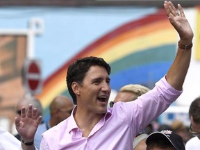 Prime Minister Justin Trudeau marches in the Ottawa Capital Pride parade, Sunday, Aug. 27, 2017. The apology from Trudeau for past state-sanctioned discrimination against LGBTQ people is welcome news for those who have been calling for such an expression of regret, but some think he is not the only one who should be there.THE CANADIAN PRESS/Justin Tang