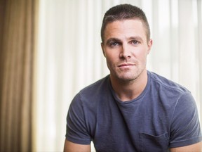 Actor Stephen Amell poses for a picture in Toronto, Tuesday, May 24, 2016. Canadian "Arrow" star Amell is offering to help "in any way, shape or form" as Warner Bros. Television Group investigates allegations of sexual harassment against an executive producer for a number of Vancouver-shot superhero shows. THE CANADIAN PRESS/Mark Blinch