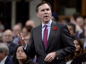 Finance Minister Bill Morneau responds to a question during Question Period in the House of Commons, in Ottawa on Tuesday, October 31, 2017. New Democrats are calling on the Trudeau government to withdraw a pension bill that they say put Finance Minister Bill Morneau in a blatant conflict of interest. THE CANADIAN PRESS/Adrian Wyld