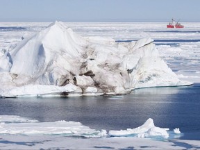 A prominent climate scientist says Canada has fallen behind on its commitment to scientific research in the Arctic and it's having an effect on Canadian sovereignty in the north. A iceberg floating in the Baffin Bay above the arctic circle dwarfs the Canadian Coast Guard icebreaker Louis S. St-Laurent Thursday, July 10, 2008. THE CANADIAN PRESS/Jonathan Hayward