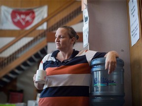 An application filed in the British Columbia Supreme Court says the provincial governments has agreed to pay back more than $5.5 million in fees deducted from the income-assistance cheques of methadone patients. Details of the agreement were filed by plaintiff Laura Shaver, shown in this August 2017 file photo, and outline how B.C. will reimburse 70 per cent of the $7.7 million, plus interest, collected from more than 11,700 methadone patients.THE CANADIAN PRESS/Darryl Dyck
