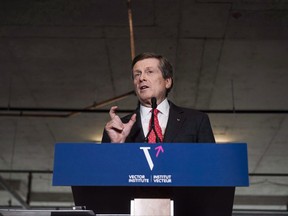 Toronto Mayor John Tory addresses an audience during the opening ceremony of the Vector Institute at the MaRS Discovery District, in Toronto on Thursday, March 30, 2017. Toronto politicians are considering major changes to security screening at city hall, but several councillors say the proposed measures would make the public building less accessible to constituents. THE CANADIAN PRESS/Christopher Katsarov