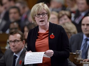 Public Services and Procurement Minister Carla Qualtrough responds to a question during Question Period in the House of Commons, in Ottawa on Tuesday, October 31, 2017. The minister responsible for the problem-plagued Phoenix pay system says a backlog of outstanding transactions being dealt with by the federal pay centre has spiked to 520,000.THE CANADIAN PRESS/Adrian Wyld