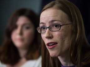 Former University of British Columbia students Glynnis Kirchmeier and Caitlin Cunningham, back, hold a news conference at the university in Vancouver, B.C., on Sunday, November 22, 2015 regarding the university's response to alleged sexual assaults by a former student who was expelled recently. The University of British Columbia has denied mishandling sexual assault reports in documents filed with the province's human rights tribunal. THE CANADIAN PRESS/Darryl Dyck