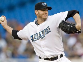 Toronto Blue Jays pitcher Roy Halladay works against the Tampa Bay Rays during first inning AL baseball action in Toronto on August 24, 2009. Former Toronto Blue Jays star pitcher Roy Halladay has died after his plane crashed in the Gulf of Mexico. He was 40. THE CANADIAN PRESS/Darren Calabrese
