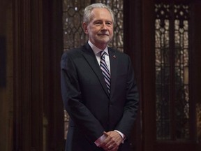 Senator Peter Harder waits in the Senate lobby in Ottawa on November 15, 2016. The federal government has opted to change course on its proposed legislation designed to end sex-based discrimination in the Indian Act. The government's point man in the Senate, Peter Harder, told the upper chamber this afternoon the proposed change will result in full legal status of First Nations women and their descendants born prior to 1985. THE CANADIAN PRESS/Adrian Wyld