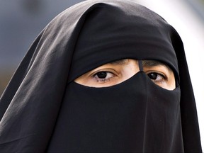 A woman wears a niqab in Montreal in a file photo from Sept. 9, 2013.