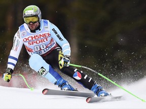 Jan Hudec of the Czech Republic heads down the course during a training run for the men's World Cup downhill ski race in Lake Louise, Alta. on Friday, Nov.24, 2017. On the right shoulder of Jan Hudec's racing suit, a Maple Leaf intersects with a lion. Meshing symbols of Canada and the Czech Republic over yet another body part that has been surgically repaired sums up Hudec's ski racing history.THE CANADIAN PRESS/Frank Gunn