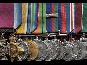 The Victoria Cross and other medals awarded to Cpl. Colin Fraser Barron are shown in this undated handout photo. Passchendaele. More than 500,000 people, including 15,000 Canadians, were killed or wounded at during the prolonged fight, as weeks of rain and shell fire churned the battlefield into a sea of mud. Yet amid the horror that enveloped a small part of Belgium in the summer and fall of 1917, were nine Canadians who would be awarded the Victoria Cross, the British Empire's highest medal for bravery. Now one of those Victoria Crosses, awarded to 24-year-old Cpl. Colin Barron for his actions exactly 100 years ago Monday, is set to go up for auction on Dec. 5. THE CANADIAN PRESS/HO - Spink & Son