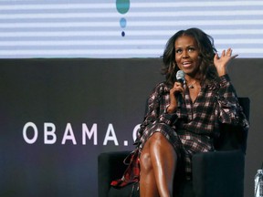 Former first lady Michelle Obama and former Vice President of the United States Joe Biden will be speaking at separate events today in Toronto. Former first lady Obama responds to a question from poet Elizabeth Alexander during the second day of the Obama Foundation Summit in Chicago on Wednesday, Nov. 1, 2017. THE CANADIAN PRESS/AP-Charles Rex Arbogast