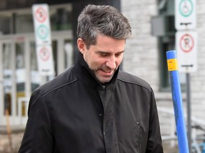 Former PQ chief, Andre Boisclair, exits a police station in Quebec City, on Thursday, Nov. 9, 2017.