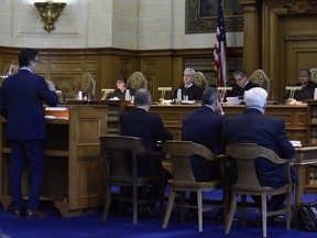 The Connecticut Supreme Court listens to attorney Josh Koskoff on arguments on whether gun maker Remington Arms should be held liable for the 2012 Newtown school massacre, in Hartford, Conn., Tuesday, Nov. 14, 2017.   A survivor and relatives of nine people killed in the shooting are trying to sue the North Carolina company that made the AR-15-style rifle used to kill 20 first-graders and six educators at Sandy Hook Elementary School. A lower court dismissed the lawsuit.  (Cloe Poisson/The Courant via AP, Pool)