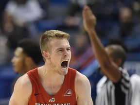 Stony Brook's Bryan Sekunda reacts after making a three-point basket during the first half of an NCAA college basketball game against Connecticut, Tuesday, Nov. 14, 2017, in Hartford, Conn. (AP Photo/Jessica Hill)