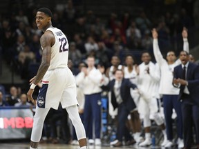 Connecticut's Terry Larrier reacts after scoring a three-point basket during the first half of an NCAA college basketball game against Colgate, Friday, Nov. 10, 2017, in Storrs, Conn. (AP Photo/Jessica Hill)